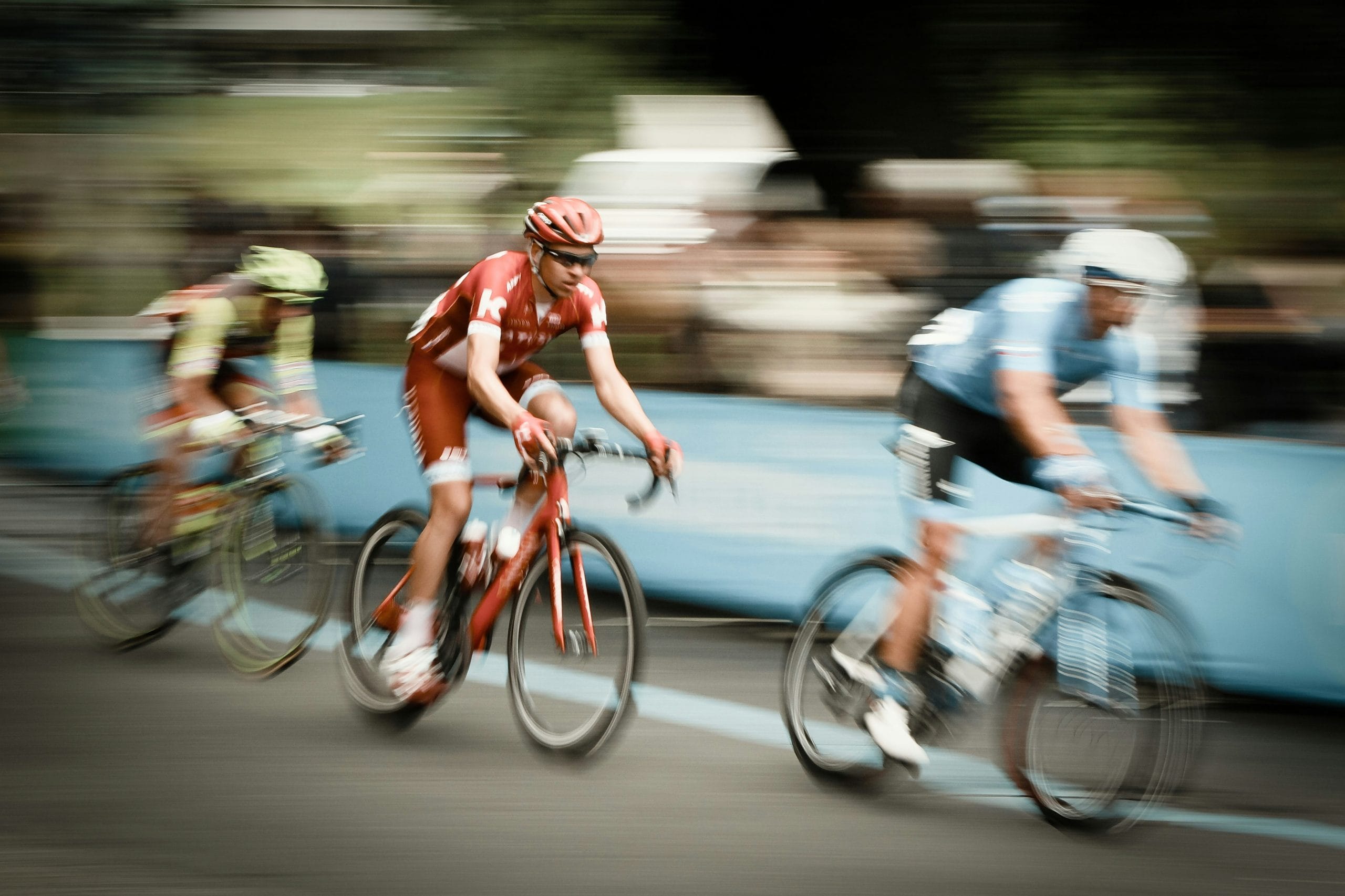 Image: Three cyclists in a cycling competition, image Paolo Candelo via Unsplash, EventFlanders