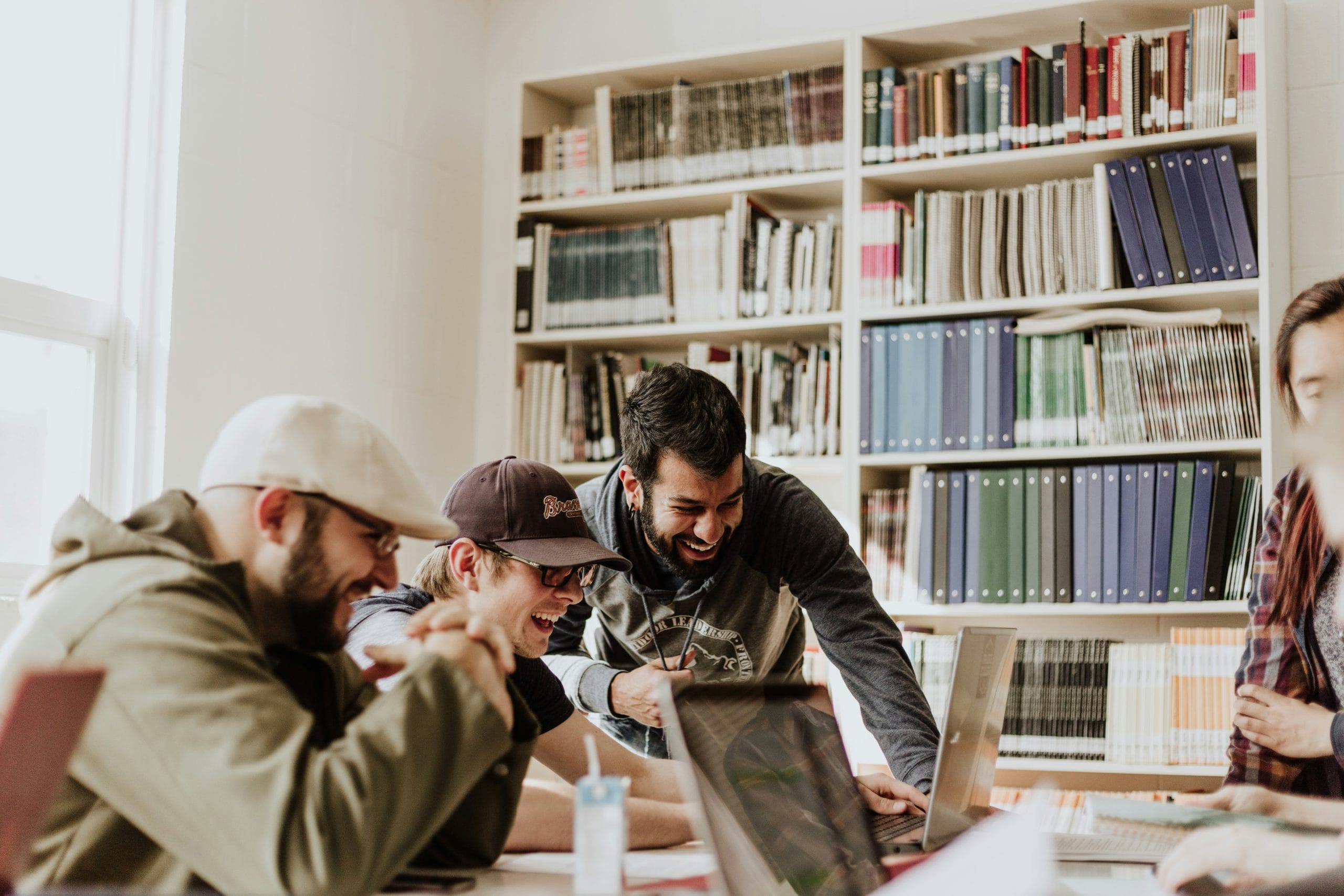 Image: Creatives working together in a library, image by Priscilla du Preez via Unsplash